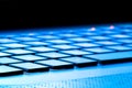 Laptop keyboard as a background toned to blue Royalty Free Stock Photo