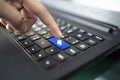 Laptop keyboard with finger pressing Heart shape key,concept happiness on the internet. closeup of male hand typing on keyboard Royalty Free Stock Photo