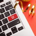 Laptop keyboard with icon shopping cart closeup Royalty Free Stock Photo