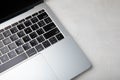 Laptop keyboard. Top view of laptop with black keyboard on white texture background. Royalty Free Stock Photo