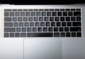 Laptop keyboard. Top view of laptop with black keyboard on white texture background. Royalty Free Stock Photo