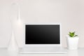 Laptop, lamp and plant in pure interior. totally white modern workspace concept Royalty Free Stock Photo