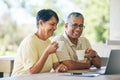 Laptop, laughing and senior couple streaming a comedy show online, internet or from a subscription service on the web Royalty Free Stock Photo