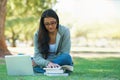 Laptop, lawn or woman in nature reading books for learning knowledge, information or education. Research, textbook or