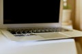 Laptop open on the work surface at an angle. Royalty Free Stock Photo