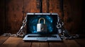 a laptop locked with lock and chains on wooden floor Royalty Free Stock Photo