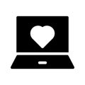 Laptop love glyph vector icon