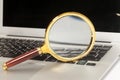 Laptop With Magnifying Glass