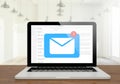 laptop mail on wooden desktop Royalty Free Stock Photo