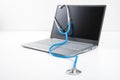 Laptop With Medicine Stethoscope. medical concept,selective focus. Laptop diagnosis with a stethoscope. computer repair and Royalty Free Stock Photo