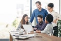 Laptop, meeting and planning with designer business people in office for creative discussion. Computer, project Royalty Free Stock Photo