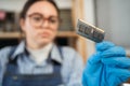 Laptop memory module in woman hands. Important computer component, close up. Electronic repair shop, technology Royalty Free Stock Photo