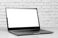 Laptop in a metal case with a white blank screen. The laptop on the table. Close up Royalty Free Stock Photo