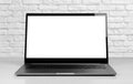 Laptop in a metal case with a white blank screen. The laptop on the table. Close up Royalty Free Stock Photo