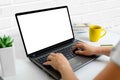 Laptop mockup close-up. Woman typing on the keyboard concept