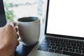 Laptop mockup and hot espresso in a white coffee mug