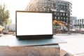 laptop mockup. Notebook with white screen with construction background. Urban, and remote work and study concept. Empty