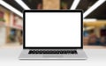 Laptop mockup with white blank display on the desk in office Royalty Free Stock Photo