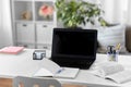 laptop, notebook and book on table at home office Royalty Free Stock Photo