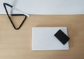 A laptop on a desk ready to telecommute