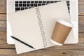 Laptop, notebook and disposable paper cup, top view. Royalty Free Stock Photo