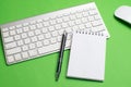 Keyboard with notepad, mouse, black pen and notebook Royalty Free Stock Photo