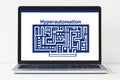 Hyperautomation concept displayed on a laptop screen with a maze design as background
