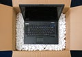 Laptop in opening package box