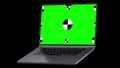 Laptop opens smoothly with a green screen on a black background. 3d Pc with chroma key for mockup. Concept computer