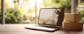 The laptop and packages on a serene workspace surrounded by nature..AI generated image Royalty Free Stock Photo