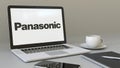 Laptop with Panasonic Corporation logo on the screen. Modern workplace conceptual editorial 3D rendering