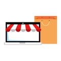 Laptop with parasol and shopping bag Royalty Free Stock Photo