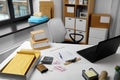 Laptop and parcels on table at post office