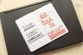 Laptop, and notebook with the words `stop smart working, go back to office`. Royalty Free Stock Photo