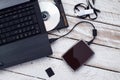 Laptop with pendrive, sd card, CD and portable hard drive. Royalty Free Stock Photo