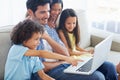 Laptop, pointing and happy family dad, kids or people gesture at online website, social network video or comic. Smile