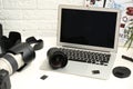 Laptop and professional photographer`s equipment Royalty Free Stock Photo