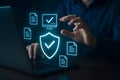 Laptop with protective shield and secure document management visuals Royalty Free Stock Photo
