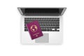 Laptop with Red Realistic Passport and Documents Royalty Free Stock Photo