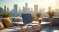 Laptop and drink on a rooftop terrace with city skyline view Royalty Free Stock Photo