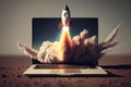 Laptop with a rocket taking off