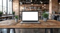 Laptop on rustic wooden table in modern cafe Royalty Free Stock Photo