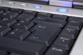 Laptop's keyboard with blue on-button Royalty Free Stock Photo