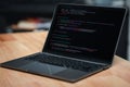 Laptop screen display blur script code, compiler, encode, debug, developer application software for business corporate with laptop Royalty Free Stock Photo