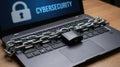 Laptop screen displaying CYBERSECURITY text padlock chain locking keyboard wooden desk Royalty Free Stock Photo