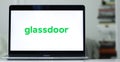 Laptop screen displaying the logo of Glassdoor, a website allowing employees to review companies