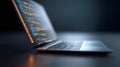 Laptop screen displaying programming code, glowing softly in dark workspace, representing digital technology, software Royalty Free Stock Photo