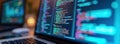 Laptop screen shows coding program. Lines of code in various colors highlight tech world. Digital business data analytics.