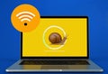 A laptop screen with a snail on it and a wifi icon Royalty Free Stock Photo
