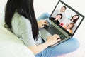 Laptop screen view over business woman talking about work,sitting by sofa make video call have distant communication using